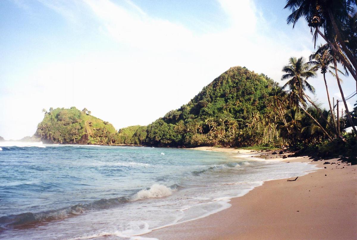 Deserted beach near Pago Pago. America Samoa is an incorporated, self-governing territory of the US. A part of the Samoan island chain, it is the southernmost territory of the US. The large harbor at Pago Pago contains a full US naval station. The inhabitants of America Samoa are American nationals, but not necessarily American citizens.