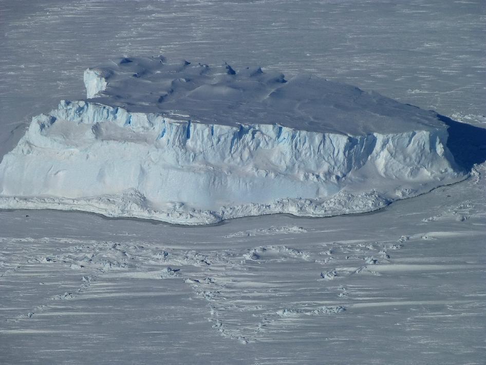 An iceberg trapped in sea ice in the Amundsen Sea, as seen from NASA's IceBridge DC-8 during a mission on 27 October 2012. Credit: NASA/Maria-Jose Vinas.