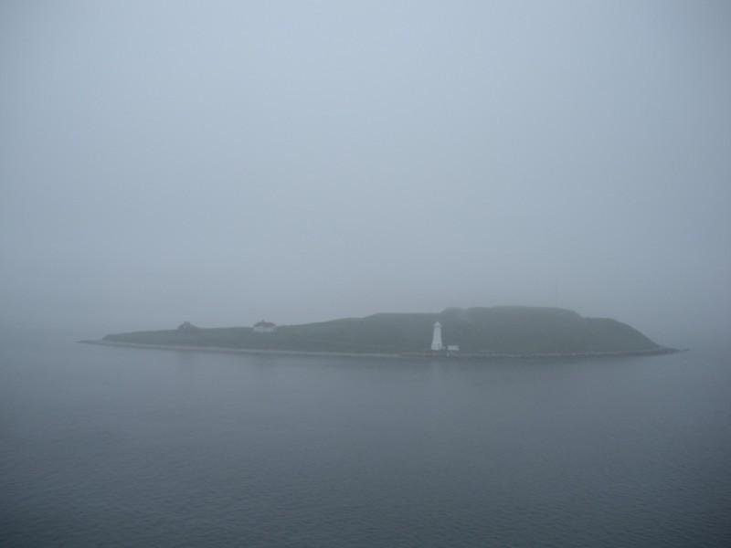 One would never guess that beyond the island in the fog, which is George's Island, lies the bustling city of Halifax, Nova Scotia.