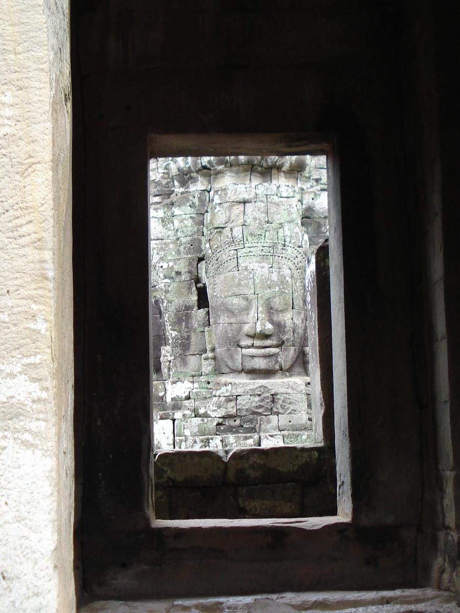 Face framed by windows at the Bayon temple at Angkor.