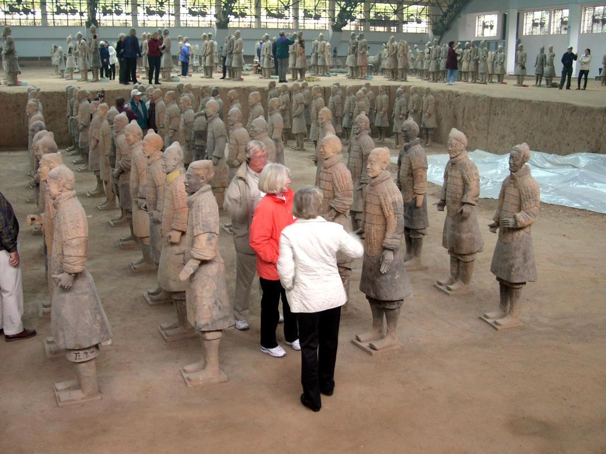 Some of the terra cotta warriors found in the mausoleum of the first Chinese Emperor Qin Shi Huang (221-210 B.C.) in Xi'an. The tomb, under an earthen pyramid, was discovered in 1974 and excavations are ongoing. The ceramic army that accompanied the ruler into the afterlife is estimated to consist of over 8,000 soldiers (each with a unique face), 100 chariots with 400 horses, and 300 cavalry horses.