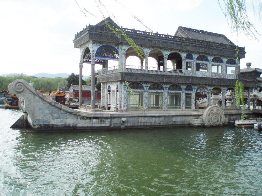 The Marble Boat at the Summer Palace in Beijing. The wooden structure was built in 1755 on a stone base and rebuilt in 1893 as a wooden lakeside pavilion in the shape of a paddle steamer. The structure is faux painted to imitate marble.