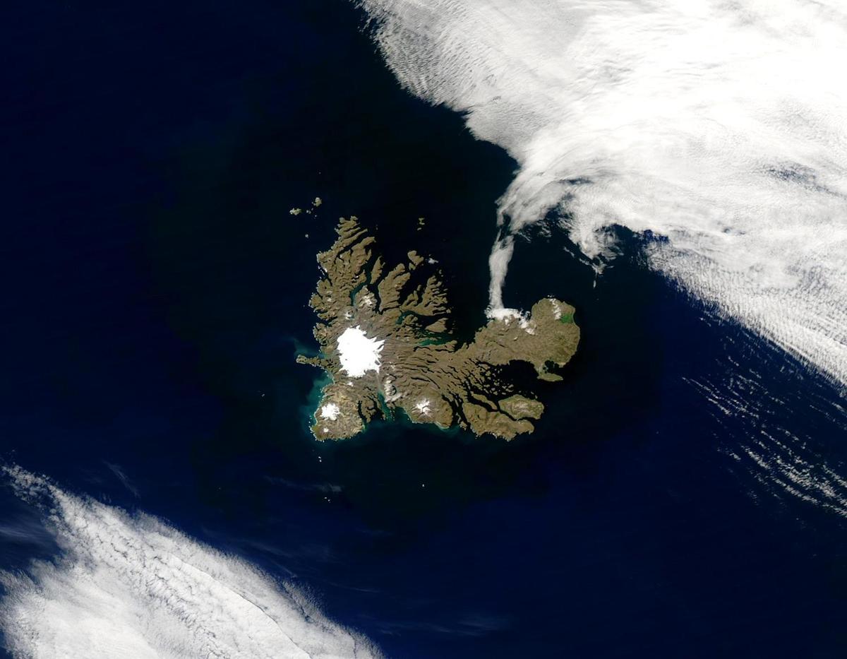 The Kerguelen Islands lie in the South Indian Ocean in a triangle formed by Australia, Africa, and Antarctica. At 1,850 m, the islands' highest point is Mount Ross, capped by a white glacier in this satellite image. Glaciation is also evident in the jagged fjords cut into the islands. The Kerguelen Islands, a territory of France, consist of one main island surrounded by about 300 smaller islands. Photo courtesy of NASA.