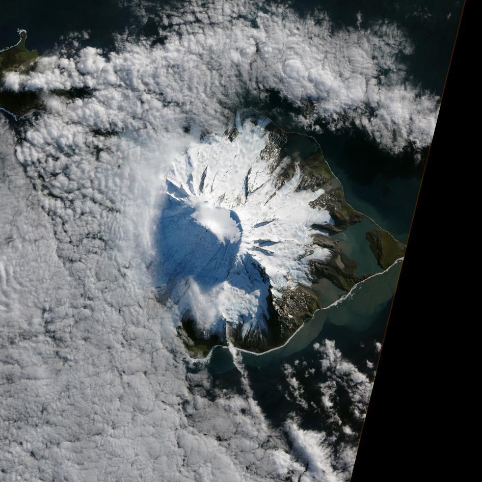 In October 2012, satellites measured subtle signals that suggested volcanic activity on remote Heard Island. These images, captured several months later, show proof of an eruption on Mawson Peak. By early April 2013, Mawson's steep-walled summit crater had filled, and a trickle of lava had spilled down the volcano's southwestern flank. Image courtesy of NASA.