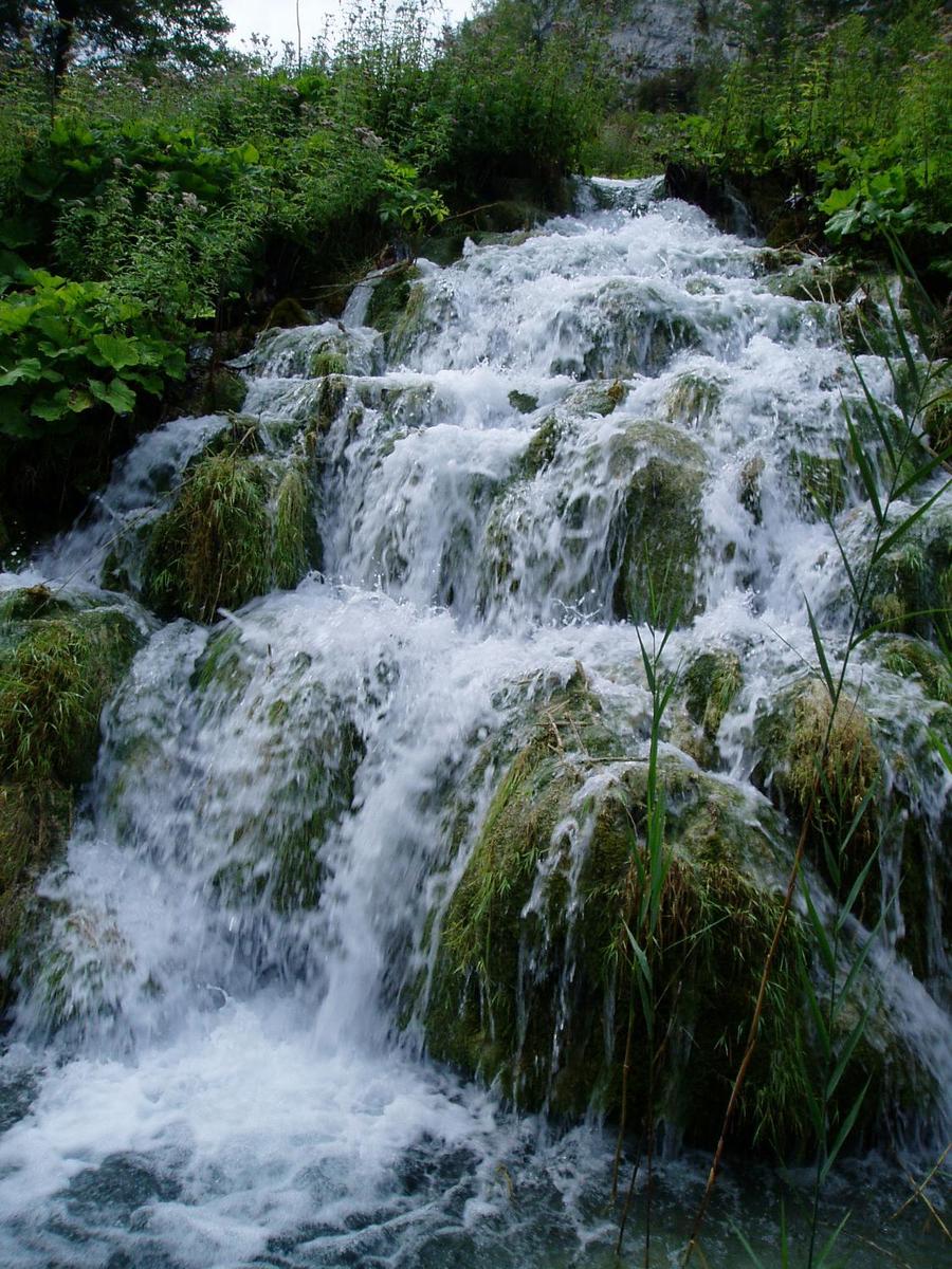 Close up of waterfalls in Plitvice National Park. The park is a favorite tourist destination and consists of 16 lakes separated by natural dams.