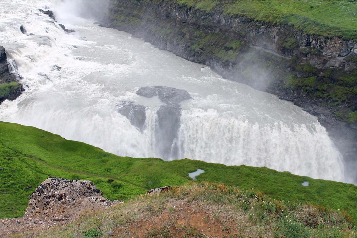 Mist rises above the Gullfoss Waterfall.