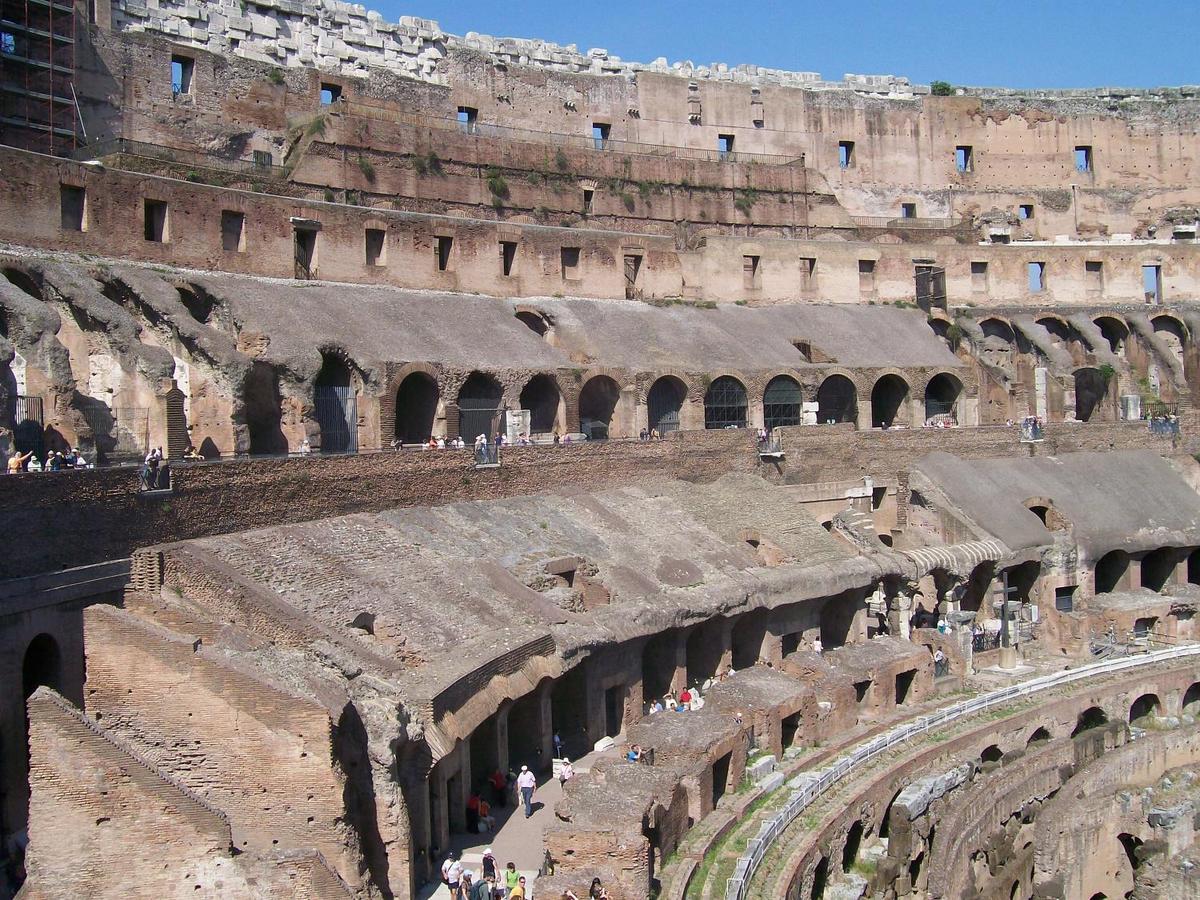 The Colosseum in Rome, the largest ever built in the Roman Empire, could seat 50,000. Begun about A.D. 70 and completed in A.D. 80, it accommodated dramas, games, and spectacles. This is a view of its ruins from the inside.