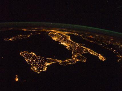 The "boot" of Italy is visible running diagonally southward from the horizon across the center of the frame, with the night lights of Rome and Naples being visible on the coast near the center. Sardinia and Corsica are just above left center of the photo, and Sicily is at lower left. The Adriatic Sea is on the other side of Italy, and beyond it to the east and north can be seen parts of several other European nations. Image courtesy of NASA.