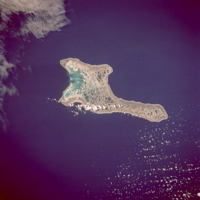 Kiritimati Island (formerly Christmas Island), the largest atoll in the Pacific Ocean, is the centerpiece of this low-oblique, northeast-looking photo. The atoll covers 606 sq km (234 sq mi), of which 243 sq km (94 sq mi) are land. The island was discovered by Captain James Cook in 1777. The majority of the island's inhabitants work on coconut plantations and in copra production. The island's major airbase is on the northeast side of the island. Nuclear tests were conducted on Kiritimati Island by the British in 1957 and 1958 and by the United States in 1962. Image courtesy of NASA.