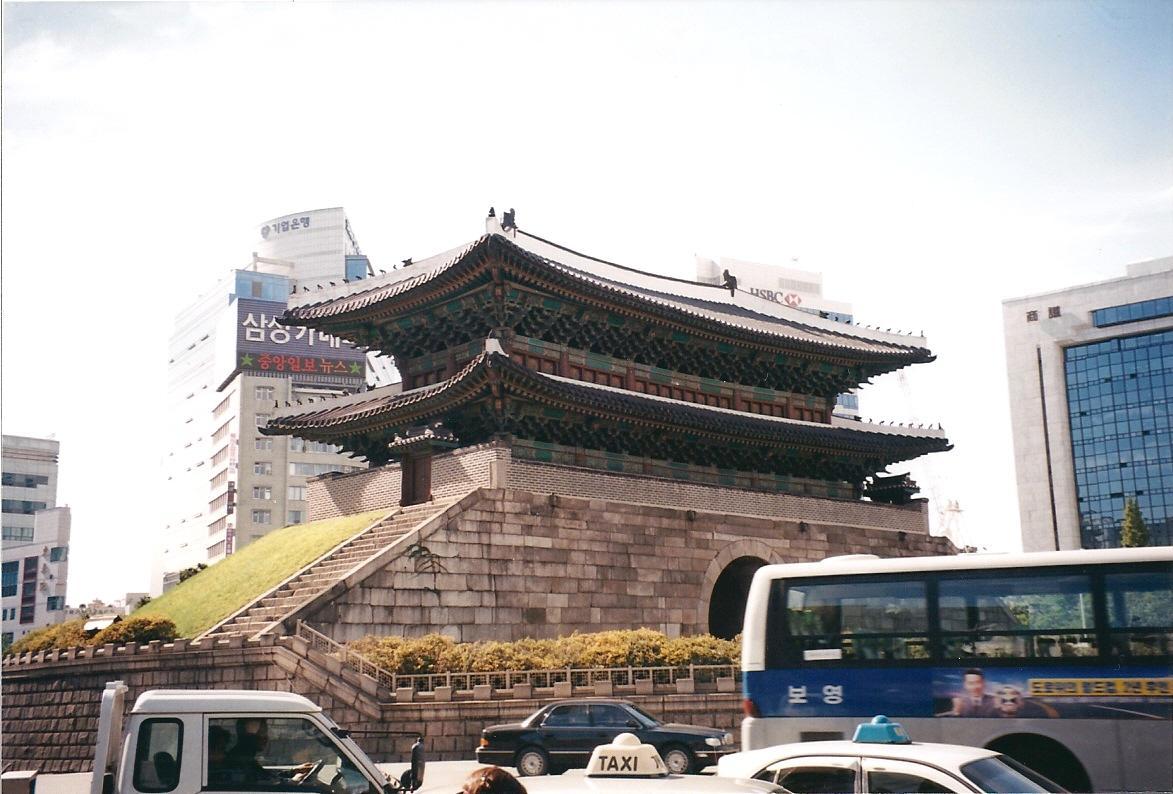 Namdaemun (Sungnyemun) in Seoul was the "Great Southern Gate" in the walls that once surrounded the city. This view was taken before the wooden upper portion was destroyed in a 2008 fire. The national treasure is currently being restored.
