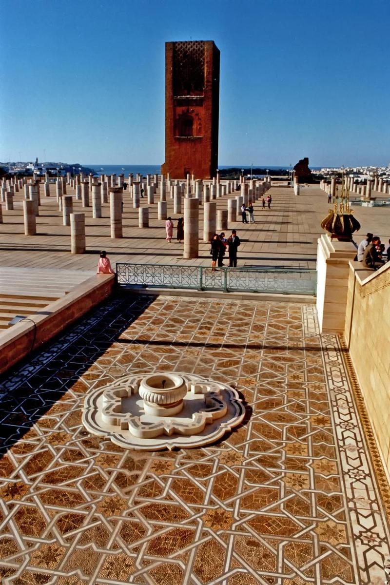The Hassan Tower and the remains of a mosque that lie adjacent to the Mausoleum of Mohammed V in Rabat. The tower (44 m, 145 ft) is an incomplete minaret that was meant to be the the tallest in the world and to flank the world's largest mosque. Begun in 1195, construction was halted four years later when the sultan who commissioned the project died.