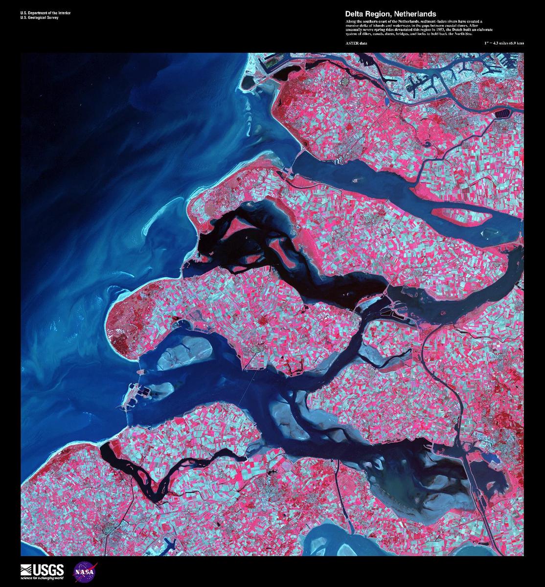 Along the southern coast of the Netherlands, sediment-laden rivers have created a massive delta of islands and waterways in the gaps between coastal dunes. The area in this false-color satellite image is extensively farmed, giving the photo its patchwork look. The Dutch have built an elaborate system of dikes, canals, dams, bridges, and locks to hold back the North Sea because of rising sea levels and devastating historic floods. The Dutch coastline has changed significantly over time due to these floods, such as the 1134 storm that formed the Zeeland archipelago when water covered massive swaths of land. Other major floods include St. Lucia's Day flood in 1287, St. Elizabeth's Day flood in 1421, and a massive flood in 1953 that sparked the building of the Delta works system in place today. The Delta works will be under stress in coming years as sea levels continue to rise. Image courtesy of USGS.