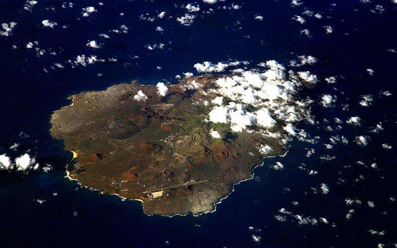 An oblique view of rugged Ascension Island, which is is barren in many places and has no indigenous human population. Instead the residents of the island are there because of Ascension's main industry: communications. The island has a long history as a communications hub for telephone and radio communications and as a base for satellite tracking stations, including a NASA station built in the 1960s that no longer operates. The European Space Agency operates a tracking station for its Ariane spacecraft on the eastern side of the island.
Ascension Island is one of the most important breeding grounds for seabirds in the tropical Atlantic Ocean. The population of seabirds has been under threat since the first humans sailed up to the island in the 1500s. The ships accidentally introduced black rats, which overran the island, until cats were introduced to curb the rat population. The feral cats have decimated the bird populations, and in fact, are probably responsible for the extinction of two of the islands native land birds. A restoration project is underway to control the cat population and revive the seabirds. Image courtesy of NASA.