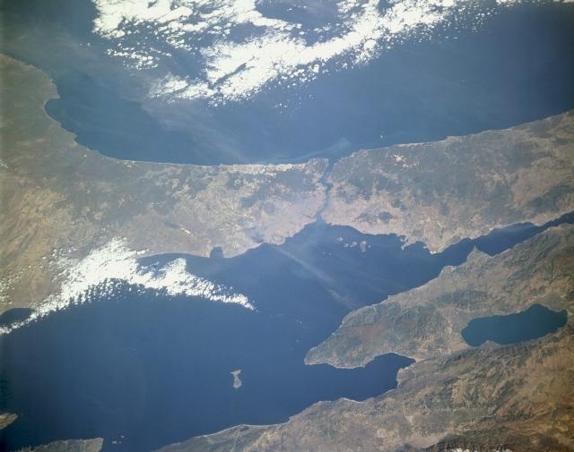 The Bosporus (near the center of the photograph), a strait that connects the Black Sea to the north with the Sea of Marmara to the south, stands out in this low-oblique, north-looking photograph. One of the world's most strategic waterways, the strait separates European Turkey to the west with Asiatic Turkey to the east. Istanbul (formerly Constantinople), one of the great historic cities of the world, sits near the Bosporus entrance to the Sea of Marmara. Photo courtesy of NASA.