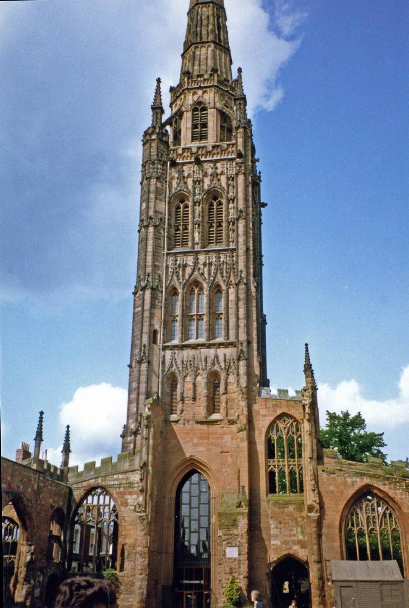 Tower, spire, and part of the outer wall of the old St. Michael's Coventry Cathedral, England. Built in the late 14th and early 15th centuries, the church was bombed and almost obliterated during the Blitz in 1940. Today it stands next to the new cathedral and serves as a place of reflection and reconciliation.