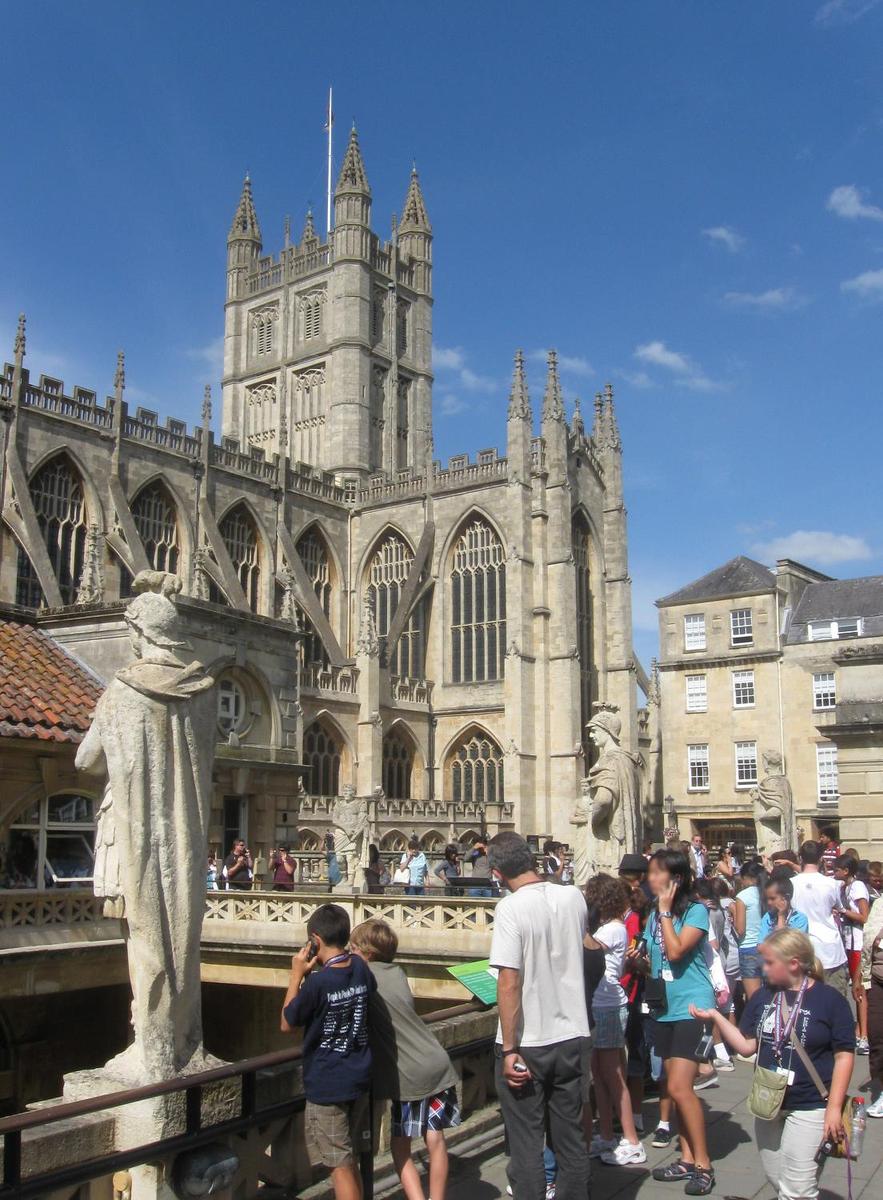 Bath Abbey stands nearby the Roman Baths in Bath, England.