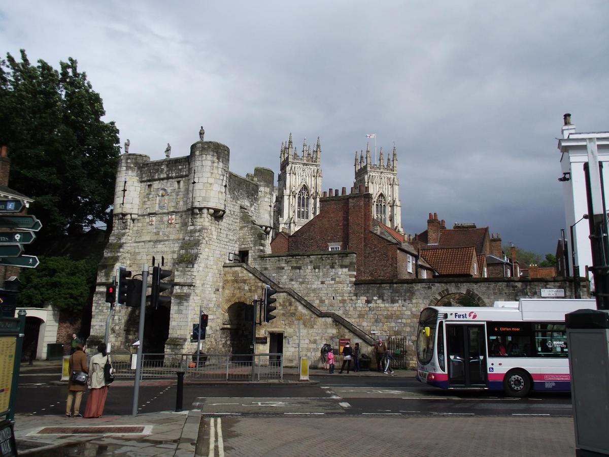 Much of York's ancient walls still survive; they are punctuated by four main gatehouses (referred to as "bars"). Bootham Bar has some of the oldest surviving stonework - dating to the 11th century A.D. It was built almost exactly on the site of the northwestern gate of Eboracum, the Roman settlement that evolved into York. This view, taken from Exhibition Square, shows York Minster, the city's famous cathedral, in the background.
