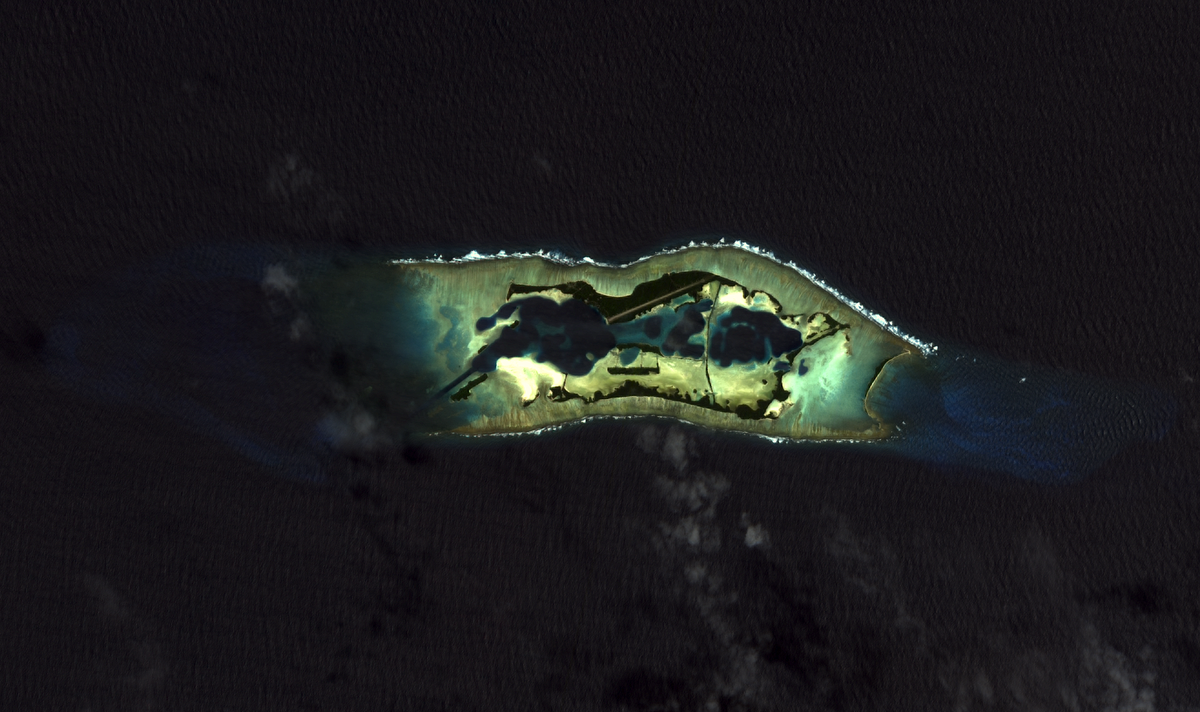 Palmyra Atoll is an unoccupied equatorial Northern Pacific atoll of some 12 sq km (4.6 sq mi) administered by the US Government. It is located almost due south of the Hawaiian Islands, roughly halfway between Hawaii and American Samoa. The atoll consists of an extensive reef, two shallow lagoons, and some 50 sand and reef-rock islets and bars covered with vegetation. Photo courtesy of NASA/USGS.