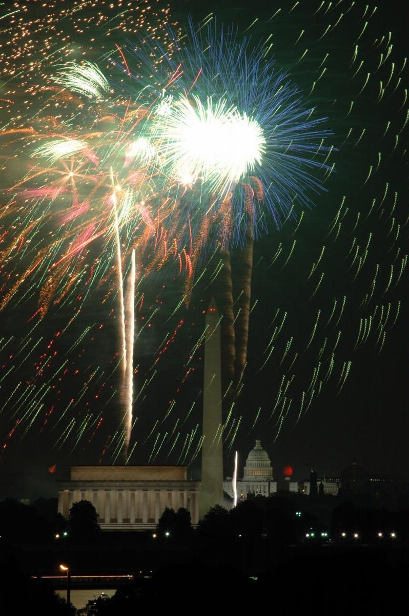 Fourth of July fireworks in Washington, DC; view of the Lincoln Memorial, the Washington Monument, and the US Capitol.
