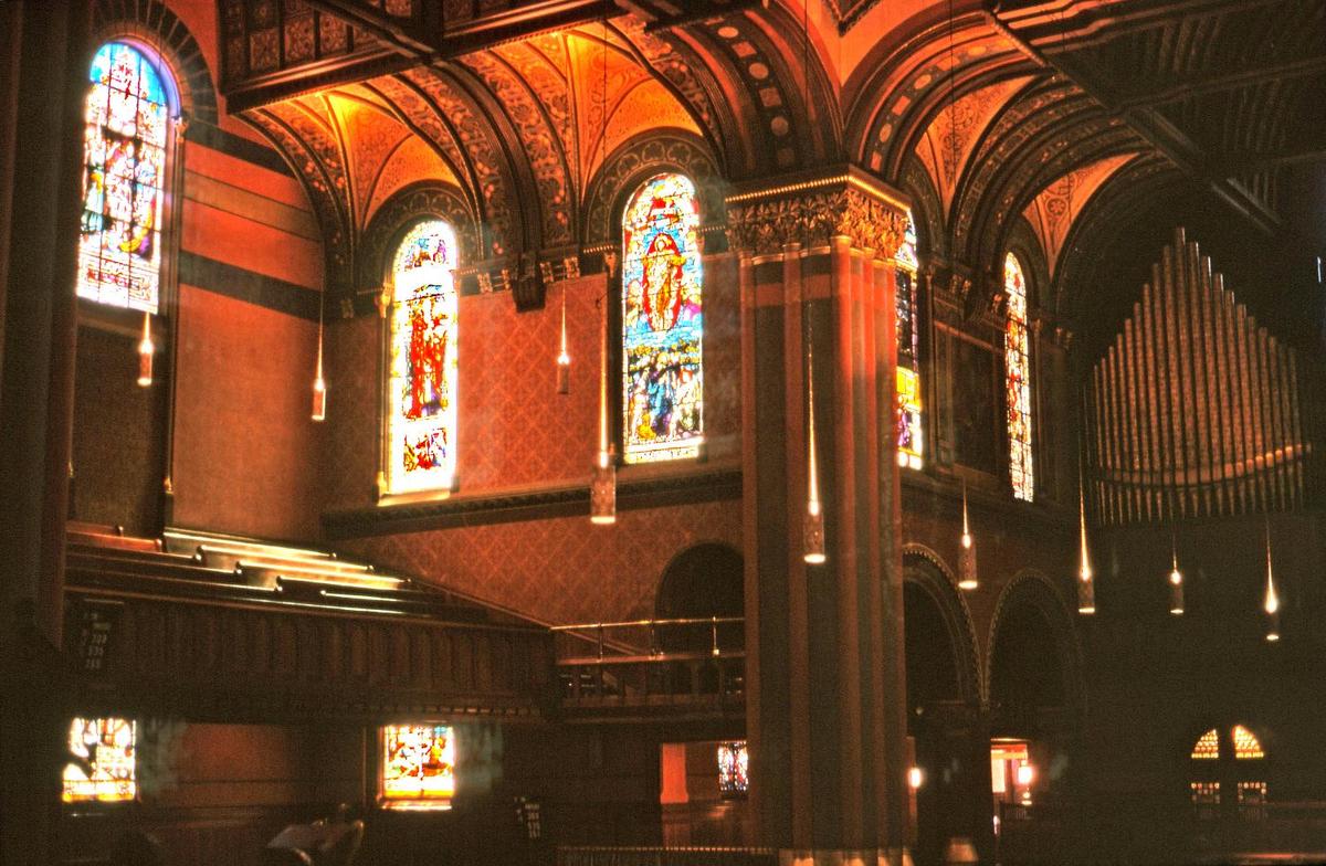 A view of the interior of Trinity Church, Boston, Massachusetts, showing some of the architectural details, stained glass windows, and the church organ.