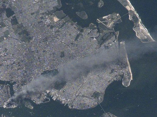 Another view of New York and environs taken from the International Space Station on 11 September 2001 following the attack on the World Trade Center. This image is one of a series taken that day of metropolitan New York City that shows the smoke plume rising from the Manhattan. Photo courtesy of NASA.