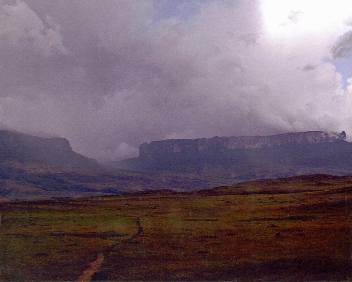 Mount Roraima on the right is the world's highest tepui (tabletop mountain), its peak is 2,835 meters; on the left is Kukeras Tepui.