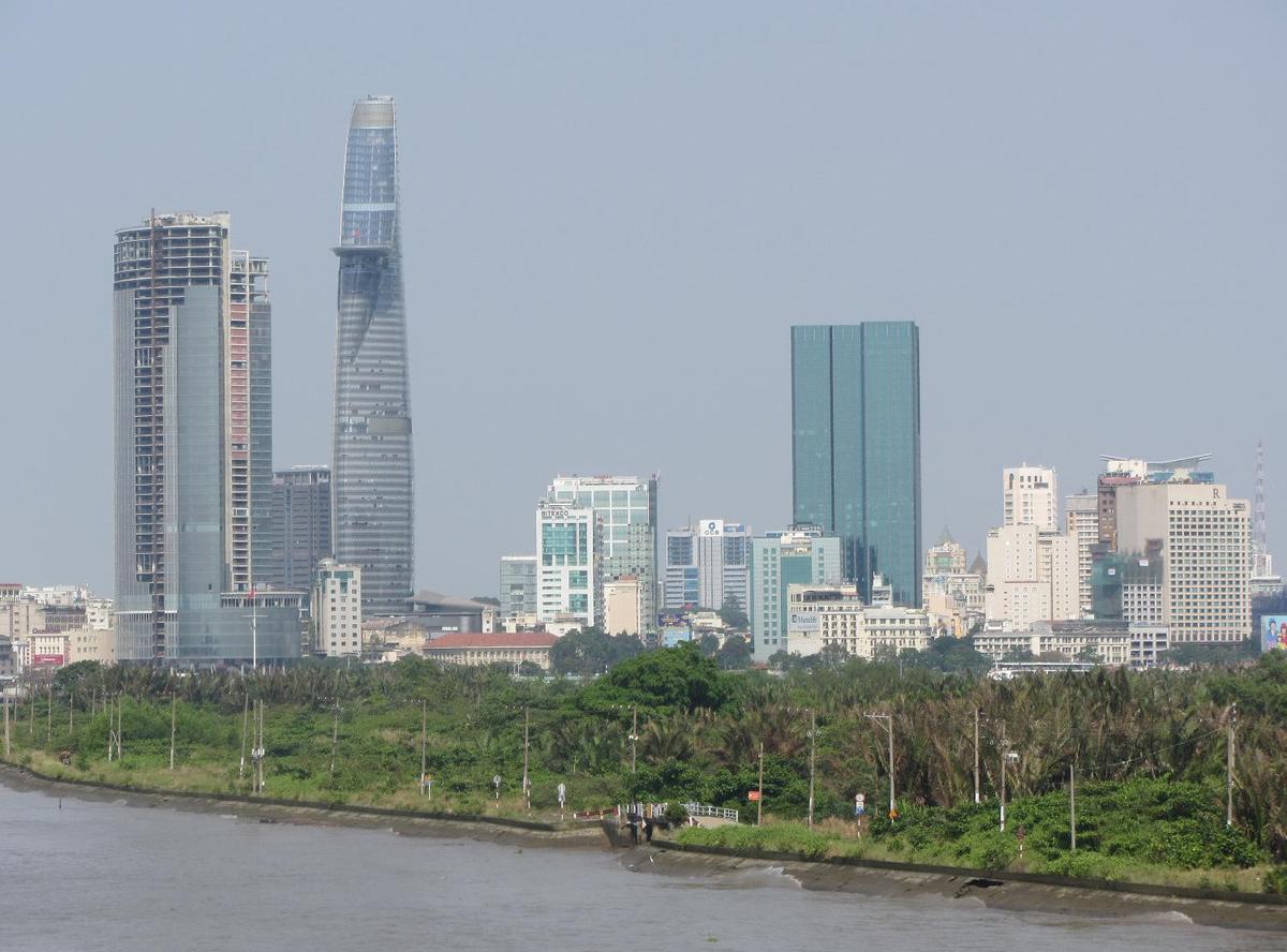 View of Ho Chi Minh City (aka Saigon) from the Saigon River. Saigon is Vietnam's major port and, with 8 million inhabitants, its largest city. It was called Saigon until 1975 when it was renamed Ho Chi Minh City following its capture by North Vietnamese communist forces. Although the city's commercial core is officially called Saigon, the entire city is widely referred to as Saigon even in the North. The city was architecturally influenced by the French during their colonial occupation of Vietnam. Numerous classical Western-style building in the city reflect this, so much so that Saigon was referred to as "The Pearl of the Far East" or "Paris in the Orient." In more recent years, a building boom has transformed the skyline of the city.