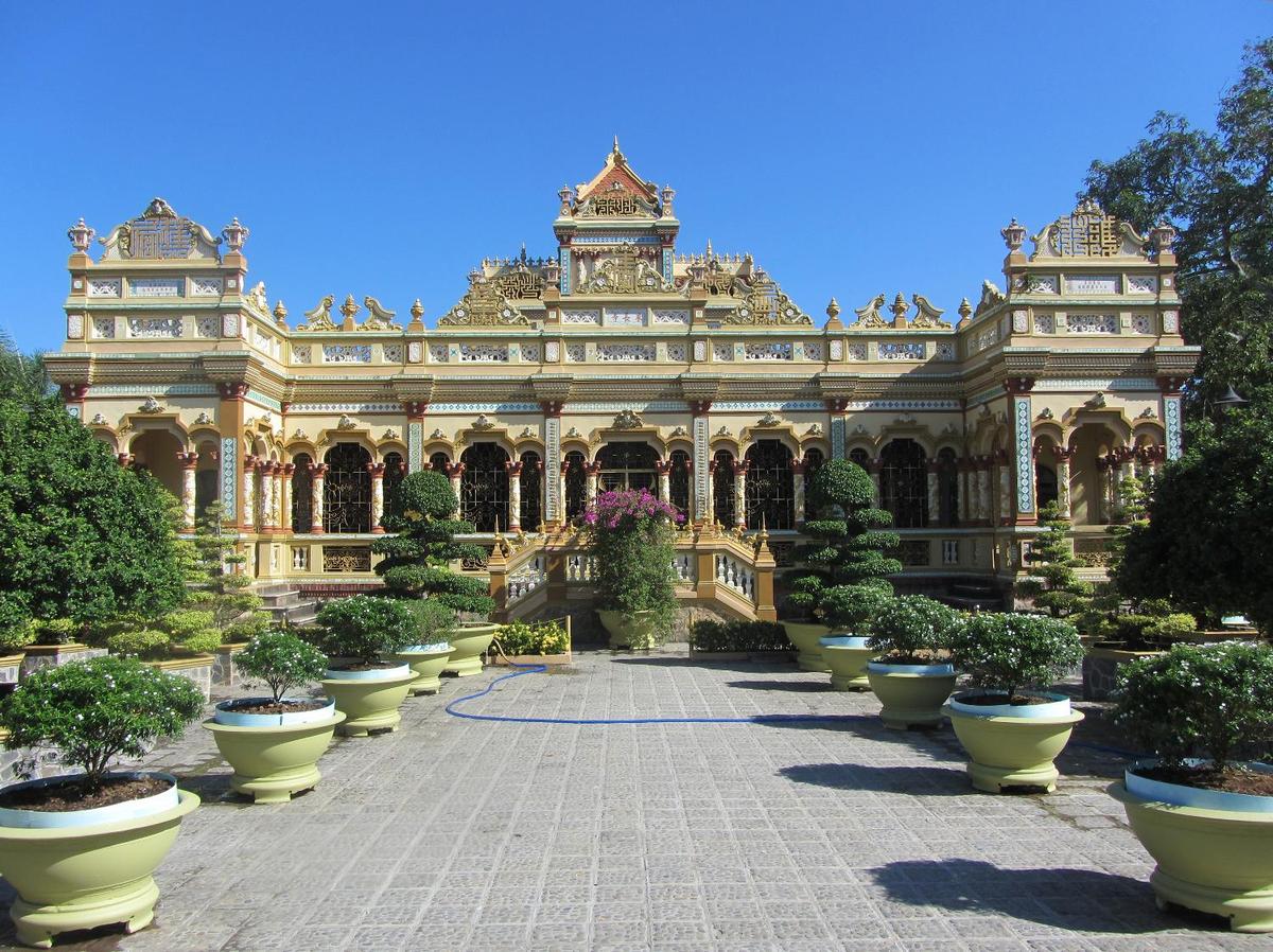 Vinh Trang Pagoda near the city of My Tho. Known of the "Gateway to the Mekong Delta," My Tho, with a population in excess of 200,000, lies on the My Tho River, a branch of the Mekong River, 70 km (45 mi) south of Saigon (Ho Chi Minh City). First completed in 1851, the Vinh Trang temple has been reconstructed a number of times.