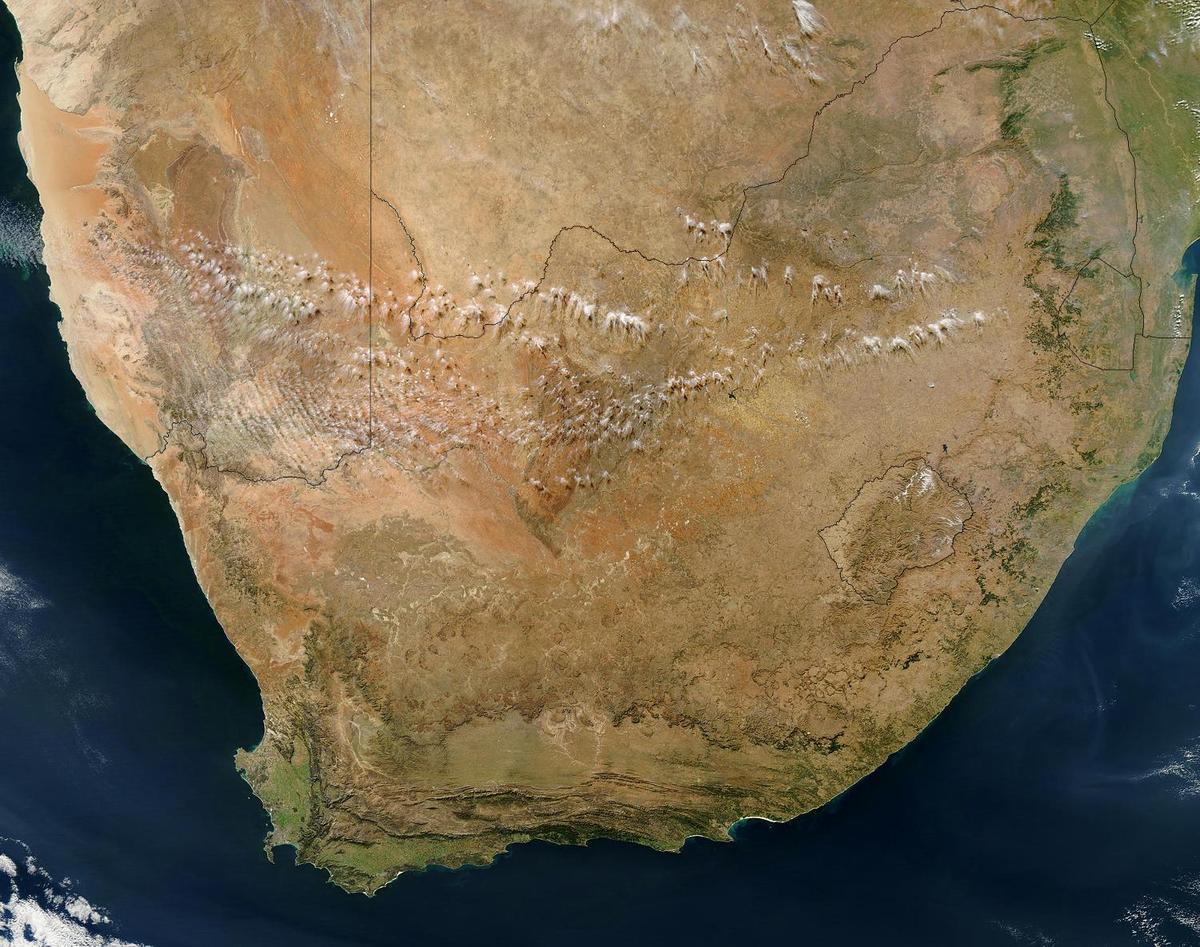 Satellite view of southern Africa. The bulk of image is taken up by the Republic of South Africa. Within South Africa is the roughly circular enclave of Lesotho. Northeast of Lesotho is the smaller country of Eswatini (formally known as Swaziland). Photo courtesy of NASA.