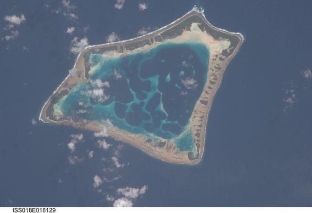 Atafu Atoll in the Southern Pacific Ocean is featured in this image photographed from the International Space Station. At roughly eight kilometers wide, Atafu Atoll is the smallest of three atolls comprising the Tokelau Islands group located in the Southern Pacific Ocean. Image courtesy of NASA.
