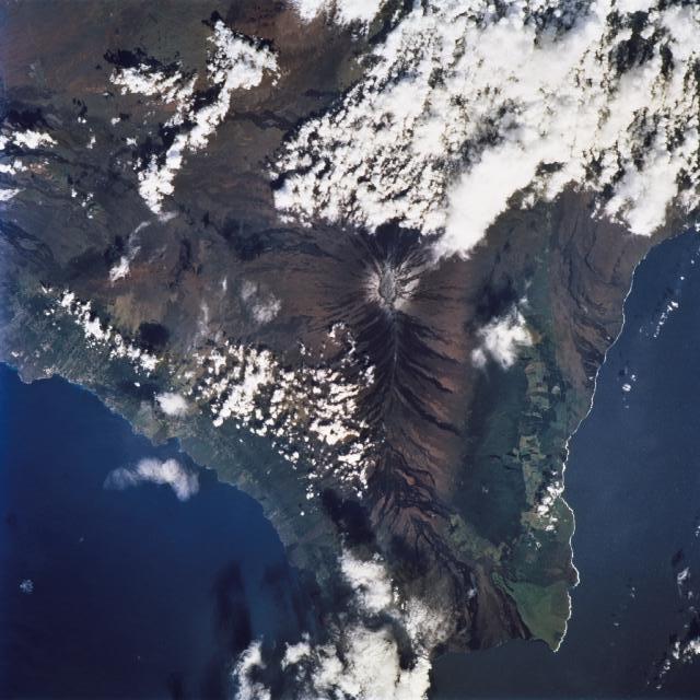 A view of the island of Hawaii (the Big Island) in the Hawaiian Islands as seen from the International Space Station. The famous volcanic mountain Mauna Loa is visible at frame center. Image courtesy of NASA.