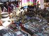 Clothing, jewelry, sculptures, and handicrafts on display at a bazaar in Kabul.