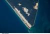 Sandy Cape and part of Fraser Island may be seen in this image photographed from the International Space Station. Fraser Island, the world's largest sand island, includes Great Sandy National Park and is located along the coastline of Queensland. The island was designated a World Heritage site in 1992, in part due to its outstanding preservation of geological processes related to sand dune formation. Image courtesy of NASA.