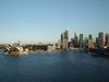View of Sydney&apos;s Harbor and skyline, including the famous Opera House.
