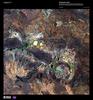 Resembling splotches of yellow and green paint, salt-encrusted seasonal lakes - the largest of which is Lake Teague - dot the floor of the Shoemaker impact crater in this enhanced satellite image. Formerly known as the Teague Ring, the structure was formed about 1.7 billion years ago and is currently the oldest known impact site in Australia. Image courtesy of USGS.