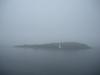One would never guess that beyond the island in the fog, which is George's Island, lies the bustling city of Halifax, Nova Scotia.