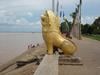 Golden lion on a Mekong River waterfront.