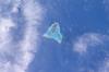 Aitutaki in the Southern Cook Islands has a distinctive equilateral triangular shape (roughly 12 km (7.5 mi) on each side). It is an "almost atoll" whose coral reef barrier does not extend above the ocean along its southern side. Image courtesy of NASA.