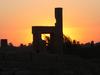 A vivid sunset behind some of the ruins at Kom Ombo.