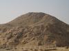 Ruins of the Pyramid of Unis at Saqqara. Much of the stone outer covering was taken to be used in other constructions.