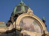 The Municipal House (Obecni Dum) is a national cultural landmark and the premier Art Noveau building in Prague. Opened in 1912 on Republic Square, it houses a concert hall and an elegant French restaurant. Shown is the large exedra under the main cupola of the building with its colorful glass mosaic depicting The Apotheosis of Prague. 