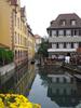 Buildings along a canal in Colmar, an Alsatian town known as "Little Venice." Situated on the Lauch River, Colmar connects to the Rhine via a canal.