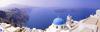 Located 200 km (120 mi) southeast of the mainland, the island of Santorini surrounds a sunken caldera formed by a volcanic explosion that occurred about 1630 B.C. The eruption destroyed and buried Akrotiri, a large Bronze Age Minoan seaport on the island. Excavations begun in 1967 are ongoing.