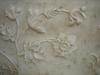 Realistic bas-relief floral design in marble at the Taj Mahal.
