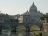 The Vittorio Emanuele Bridge over the Tiber River in Rome with Vatican City (and St. Peter&apos;s Basilica) in the background. 