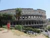 The Colosseum in Rome was first used in A.D. 80.  In Roman times, it was called the Flavian Amphitheater and held 50,000 spectators. The name &quot;Colosseum&quot; was introduce in medieval times and referred to a giant statue of Nero that stood nearby.  The outer walls have three levels of arches with columns topped by Ionic capitals at the lower level and Doric and Corinthian at the top. The 80 entrance/exit arches, known as vomitoria, allowed spectators easy access and the ability to clear the building in minutes.