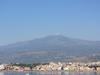 The city of Naxos in Sicily lies at the foot of Mount Etna. The resort city of Taormina is 7 km (4.5 mi) in the distance.
