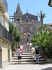 Steps leading to the Church of the Holy Trinity and to the Convento Agostiniano (Augustinian Convent) in Forza d&apos;Agro in Sicily. The arch is named the Porta Durazzo.
