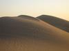The sand dunes of the Sahara Desert are stunning, but are not the most common landform. Rock and gravel landscapes are much more common, though less photogenic.