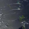 The Soufriere Hills Volcano on the island of Montserrat produced a plume of volcanic ash and/or steam on 1 October 2006, part of a continuing pattern of intermittent eruptions. In this image, the island of Montserrat shows an area outlined in red - the thermal hotspot. The plume of volcanic ash blows westward over the Caribbean Sea, gradually dissipating as it moves away. No recorded eruptions of the volcano occurred before 1995, but since then, volcanic ash emissions have posed recurring health hazards for Montserrat's residents. Photo courtesy of NASA.